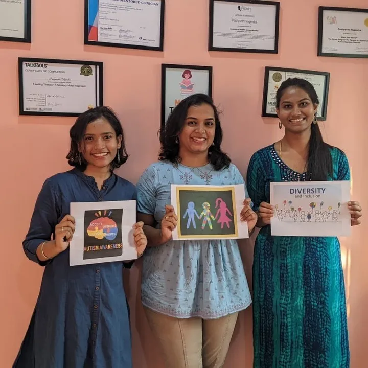 The Turtle Express team holding certificates and posters